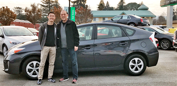 Father and son at Enterprise car sale