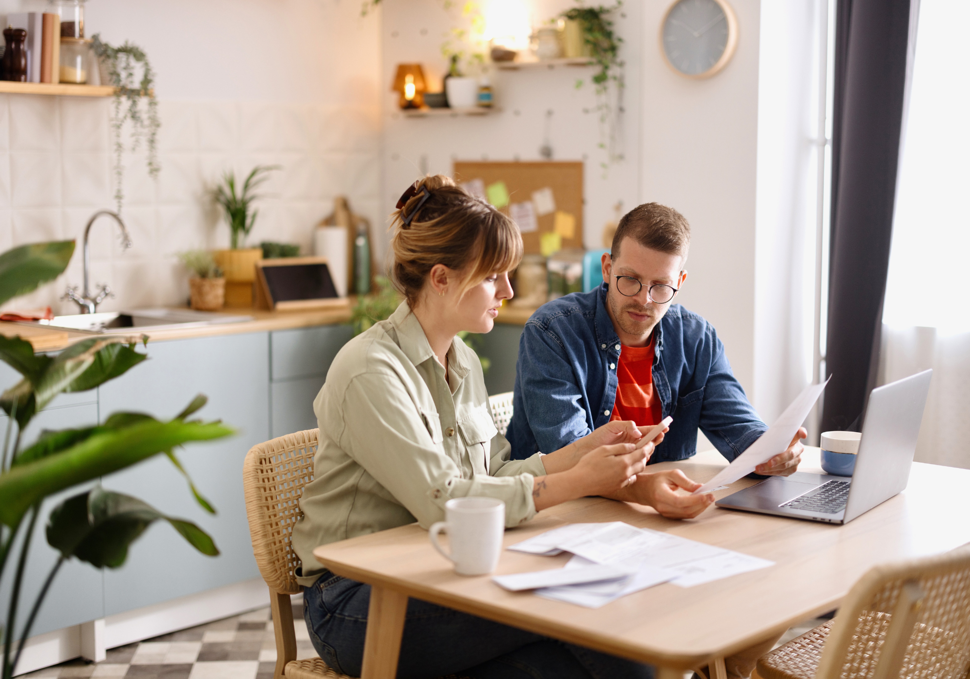 couple reviewing mortgage insurance options on laptop