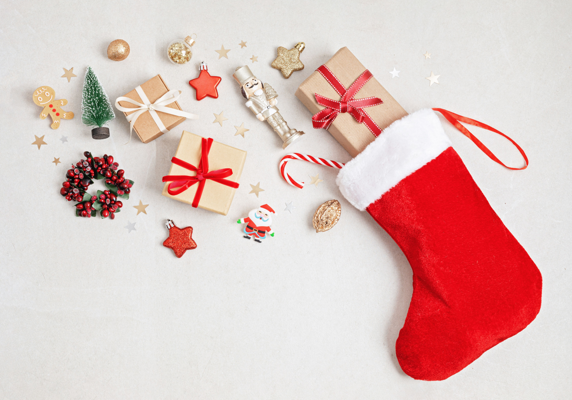 Red Christmas stocking filled with presents. 