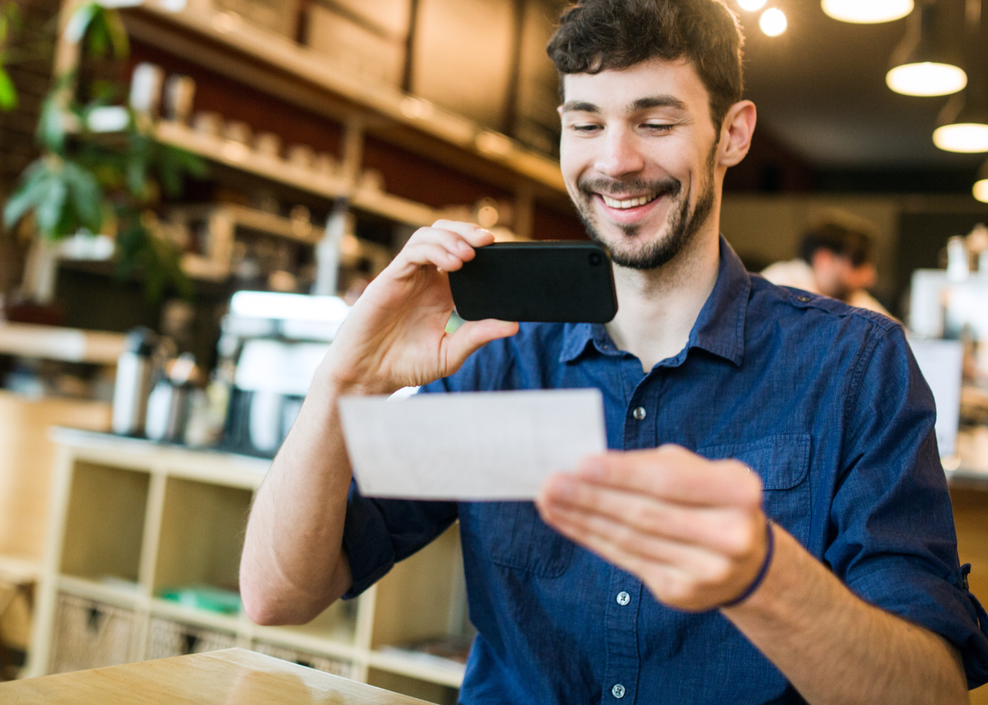 The Police Credit Union member depositing check with mobile deposit