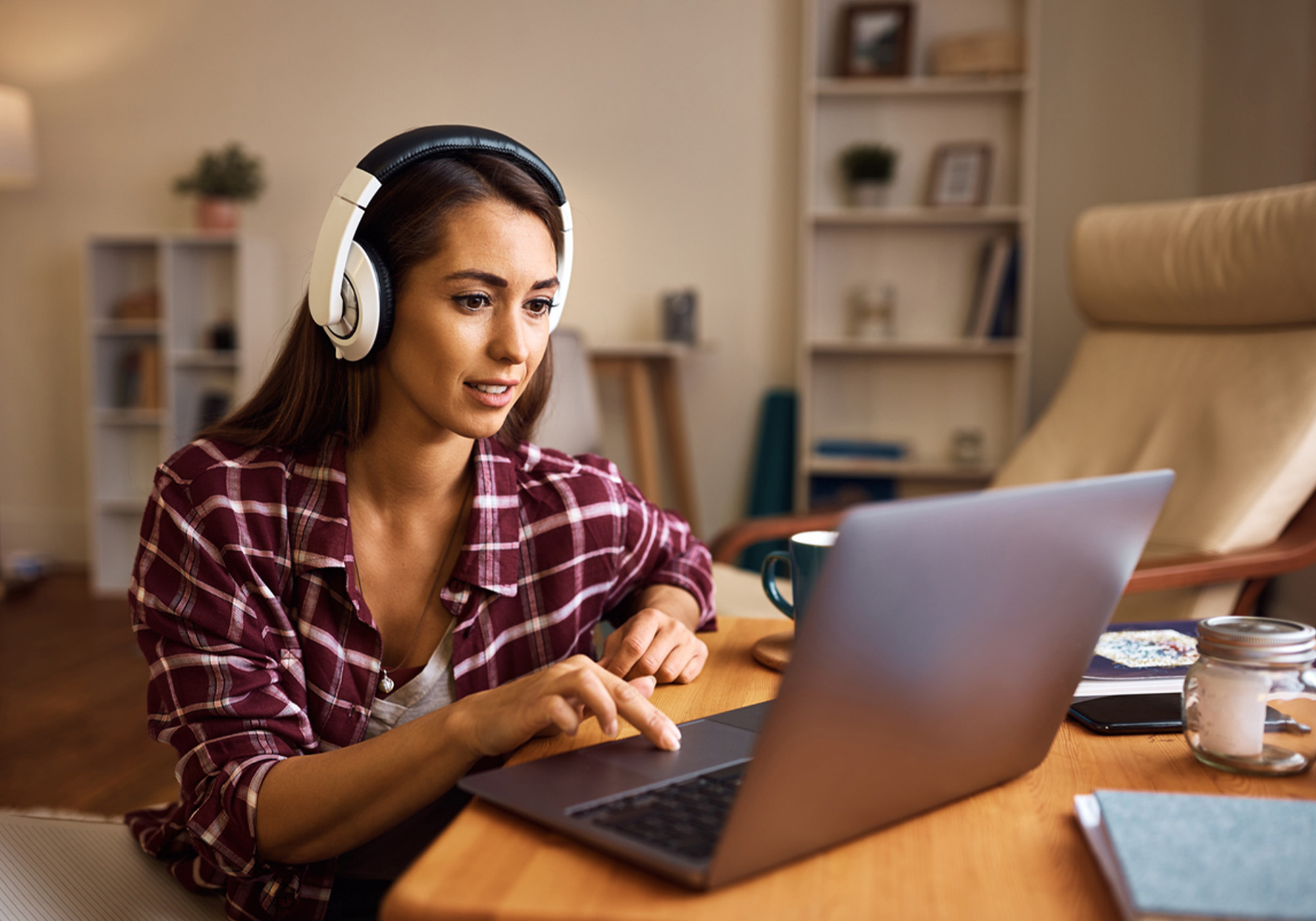 Gen Z using a laptop to review personal finances and budget online.