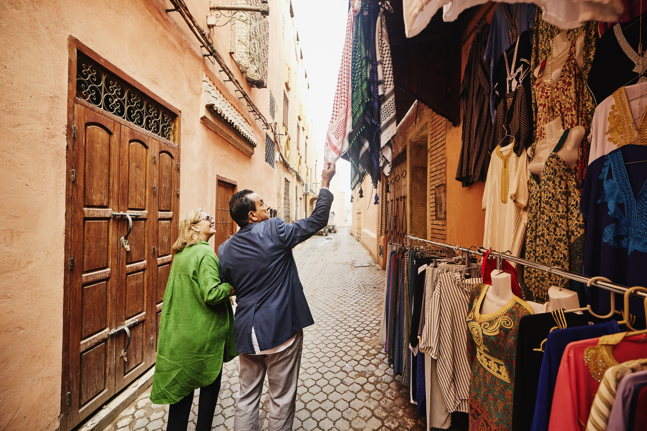 couple looking at clothes in outside market