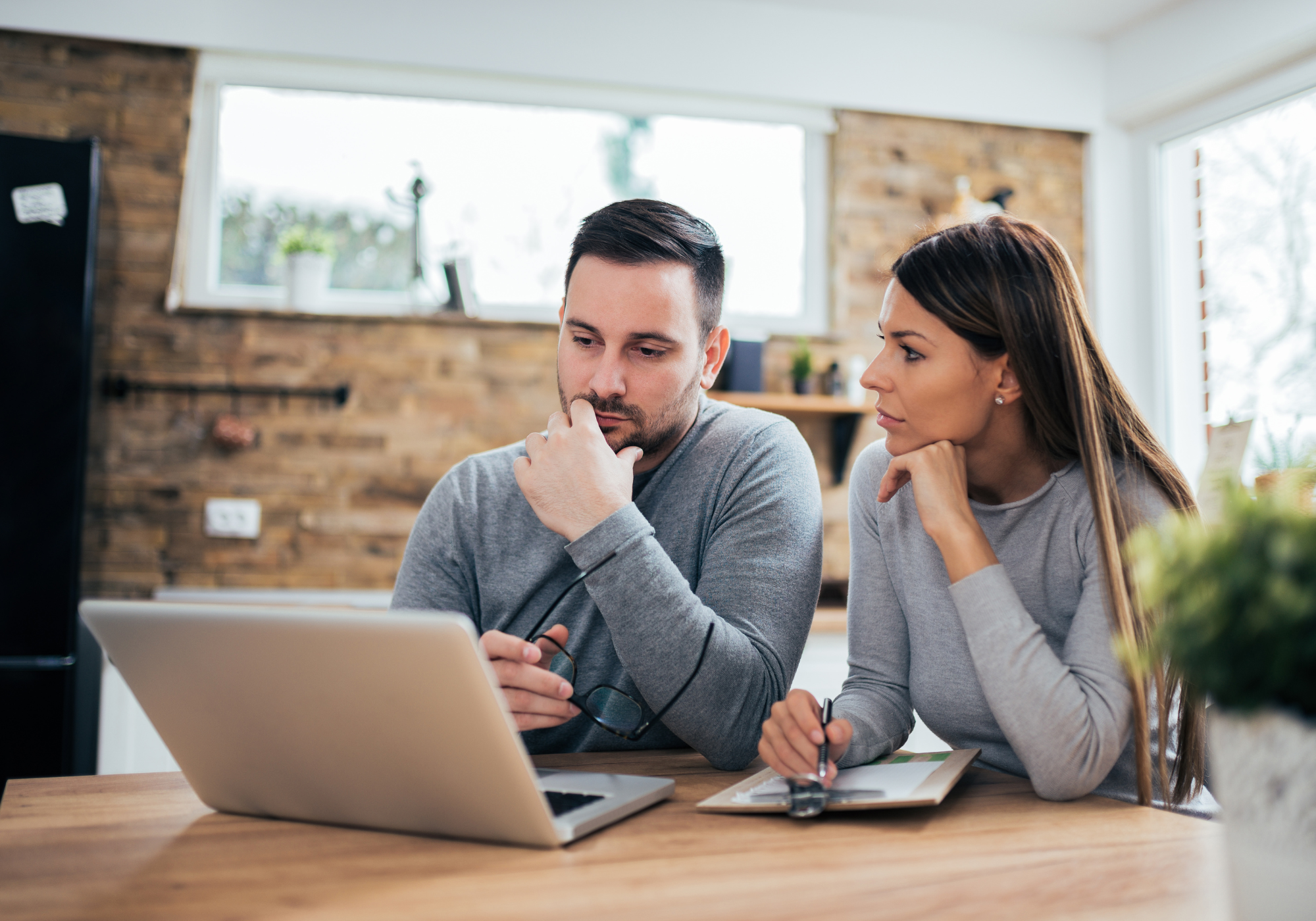 couple reviewing identity theft options on laptop