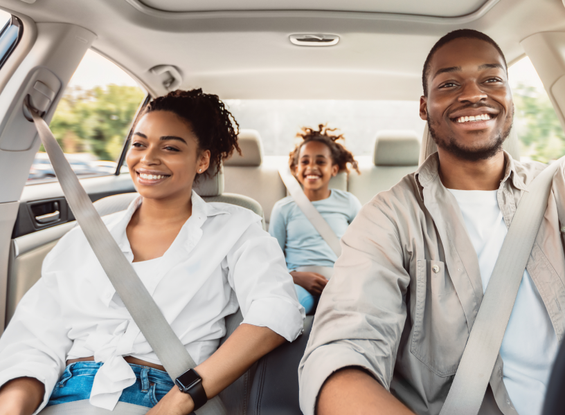 parents in car with daughter in back seat