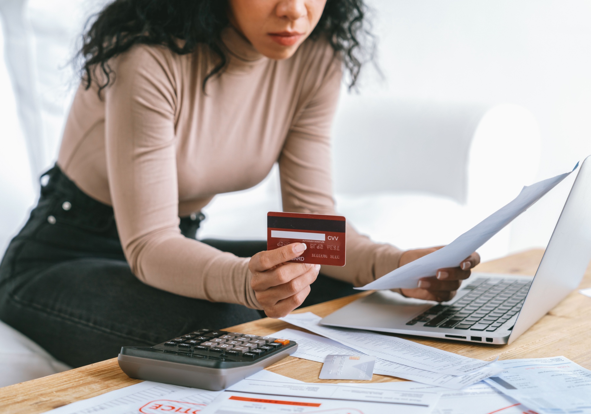 woman looking at bank statement 