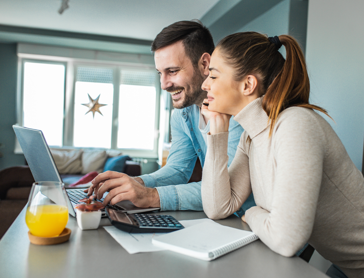 couple reviewing finances with MoneyTrac